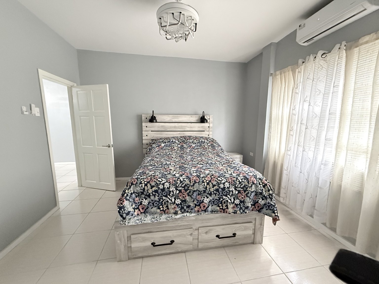 Furnished bedroom with air conditioning